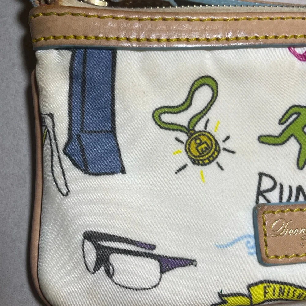 Dooney & Bourke Disney Sketch Marathon Wristlet 70.3 Run is a small wristlet